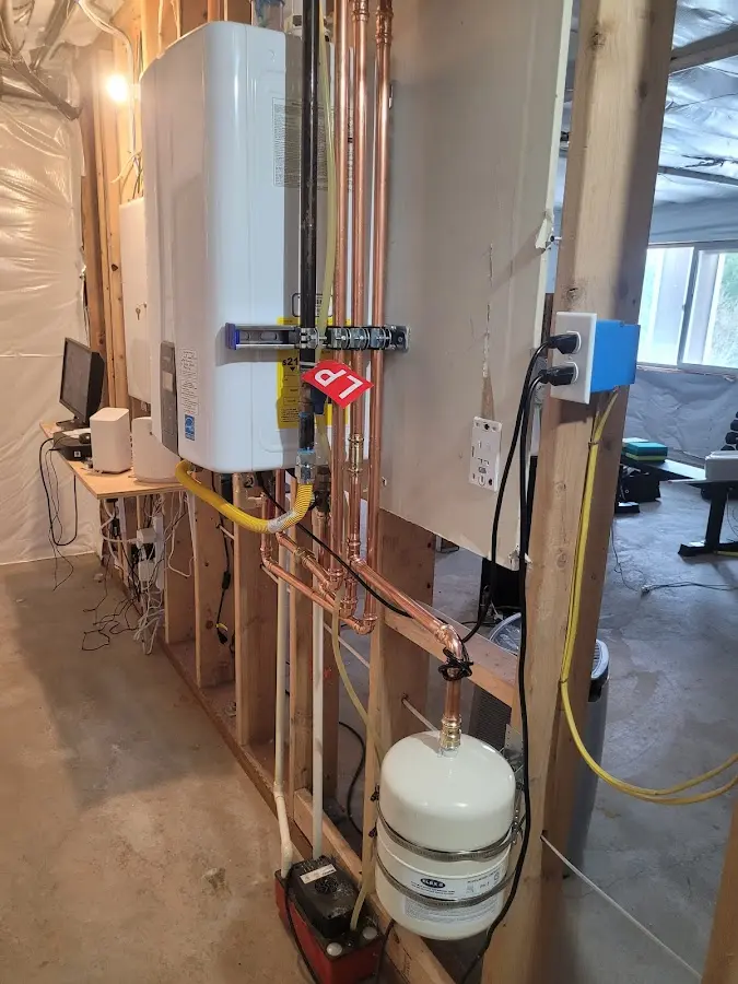 Licensed plumber repairing a kitchen sink in Sparta